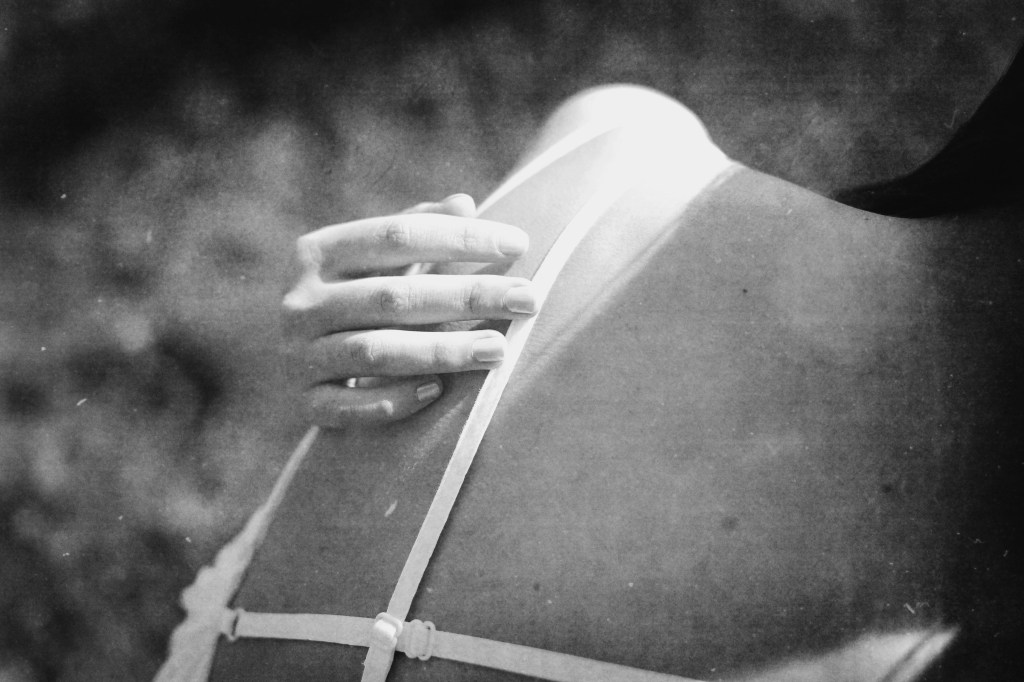 embrace-hand-on-back-black-white